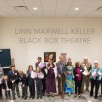 Another ribbon cutting photo with bits of the ribbon on the ground.